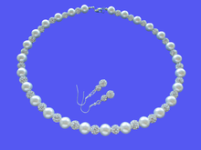 Load image into Gallery viewer, A handmade pearl and crystal necklace accompanied by a pair of crystal earrings.