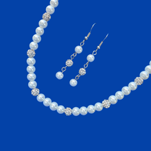 Load image into Gallery viewer, handmade pearl and crystal necklace accompanied by a pair of drop earrings