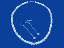 Load image into Gallery viewer, A handmade pearl and crystal necklace accompanied by a pair of crystal drop earrings