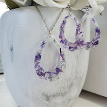 Load image into Gallery viewer, Handmade real flower teardrop pendant necklace accompanied by a matching pair of stud drop earrings made with purple statice and silver flakes preserved in resin. Resin Jewelry, Flower Jewelry, Jewelry Sets