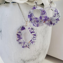 Load image into Gallery viewer, Handmade real flower oval pendant necklace accompanied by a pair of circular stud earrings made with purple statice and silver leaf preserved in resin. - Pressed Flower Jewelry, Flower Jewelry, Jewelry Sets