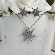 Load image into Gallery viewer, Handmade snowflake drop necklace accompanied by a pair of stud earrings made with glitter preserved in resin. silver or custom color - Snowflake Necklace Set - Winter Jewelry - Jewelry Sets