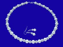 Load image into Gallery viewer, A handmade pearl and crystal necklace accompanied by a pair of drop earrings.