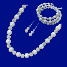 Load image into Gallery viewer, A handmade pearl and crystal necklace accompanied by an expandable multi-layer wrap bracelet and a pair of crystal drop earrings.