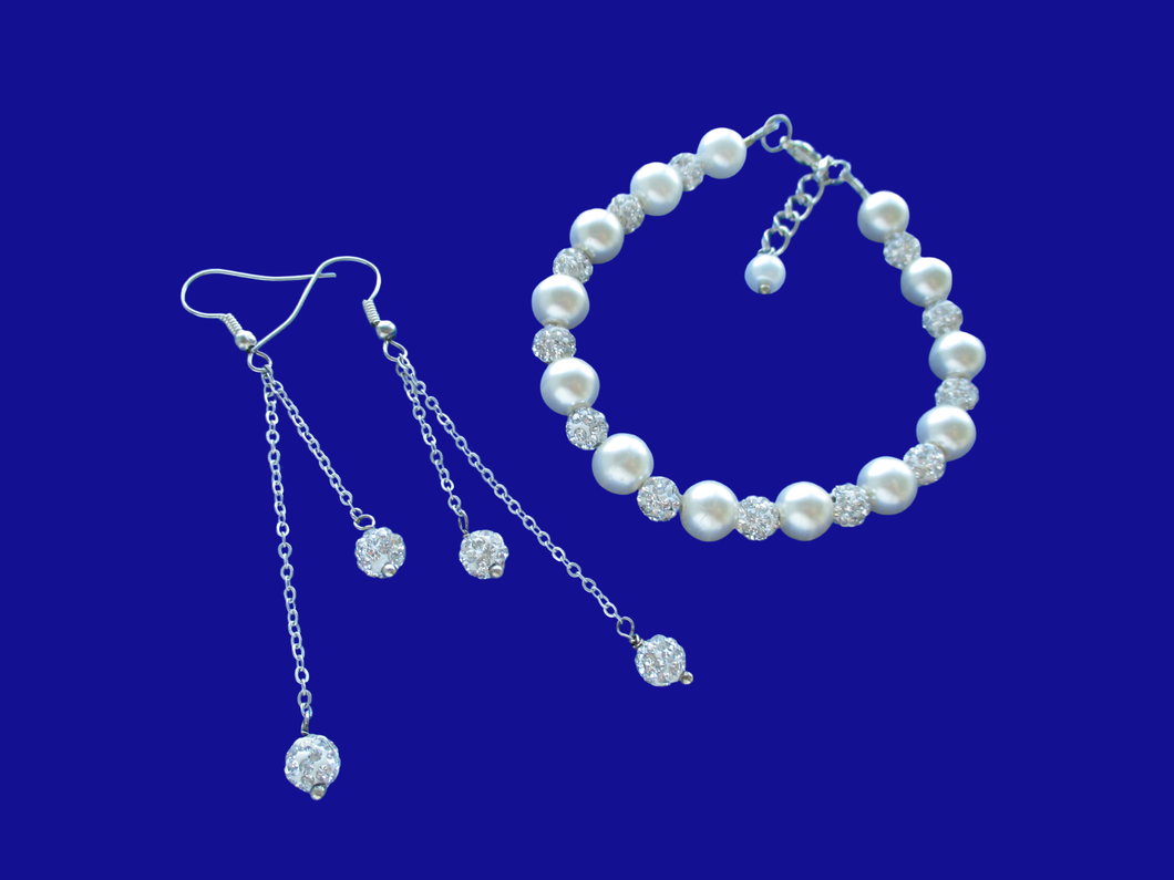 A handmade pearl and crystal bracelet accompanied by a pair of multi-strand drop earrings. 