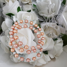 Load image into Gallery viewer, Handmade pearl and pave crystal rhinestone expandable, multi-layer, wrap bracelet accompanied by a pair of double-strand crystal drop earrings, powder orange or custom color - Bracelet Sets - Bride Gift - Bridal Gift Ideas