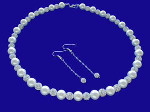 A handmade pearl and crystal necklace accompanied by a pair of crystal drop earrings. 