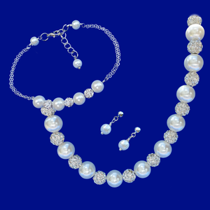 handmade crystal and pearl necklace accompanied by a bar bracelet and a pair of pearl stud earrings