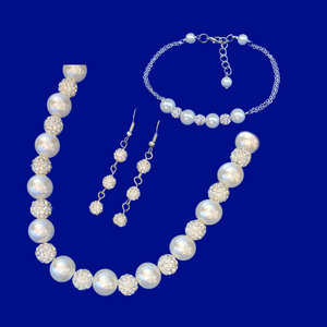 handmade pearl and crystal necklace accompanied by a bar bracelet and a pair of crystal drop earrings