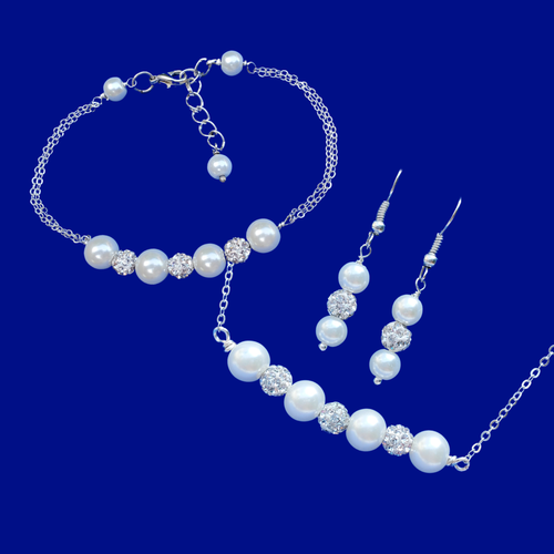 pearl and crystal bar necklace accompanied by a matching bracelet and a pair of drop earrings