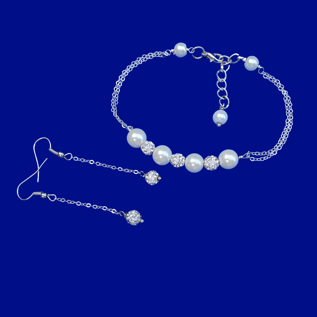 handmade pearl and crystal bar bracelet accompanied by a pair of crystal drop earrings