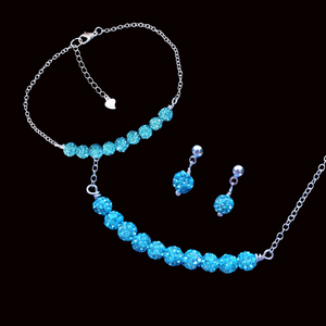 handmade crystal bar necklace accompanied by a matching bracelet and a pair of stud earrings
