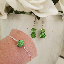 Load image into Gallery viewer, Handmade floating crystal bracelet accompanied by a pair of drop earrings - peridot (green) or custom color - Earring Sets - Bridal Jewelry Set - Bracelet Sets