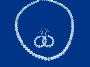 handmade pearl and crystal necklace accompanied by a pair of hoop earrings