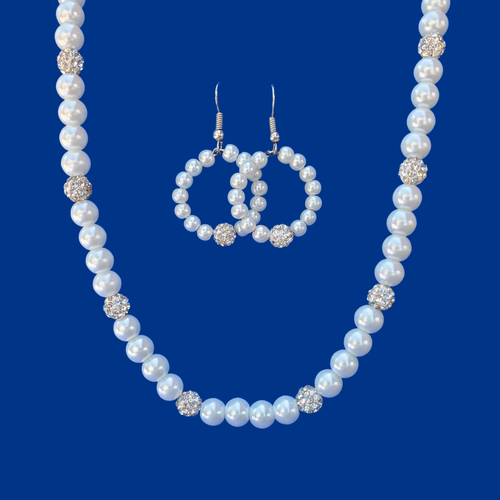 handmade pearl and crystal necklace accompanied by a pair of hoop earrings