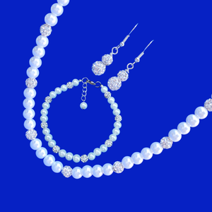 handmade pearl and crystal necklace accompanied by a matching bracelet and a pair of crystal drop earrings