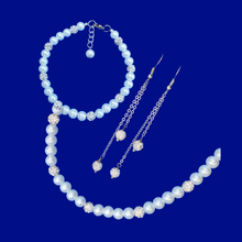 Load image into Gallery viewer, pearl and crystal necklace accompanied by a matching bracelet and a pair of multi-strand crystal earrings