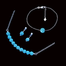 Load image into Gallery viewer, handmade crystal bar necklace accompanied by a floating bracelet and a pair of stud earrings