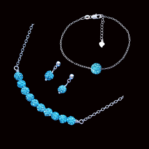 handmade crystal bar necklace accompanied by a floating bracelet and a pair of stud earrings