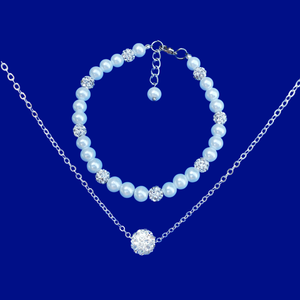 handmade floating crystal necklace accompanied by a pearl and crystal bracelet