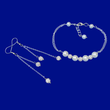 Load image into Gallery viewer, handmade pearl and crystal bar bracelet accompanied by a pair of multi-strand drop earrings