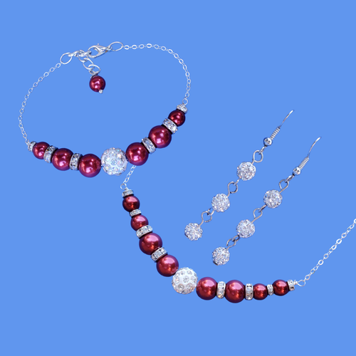 handmade pearl and crystal bar necklace accompanied by a bar bracelet and a pair of crystal drop earrings
