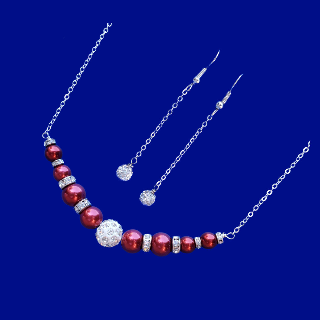 handmade pearl and crystal bar necklace accompanied by a pair of crystal drop earrings