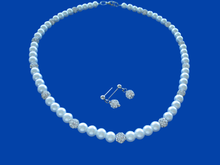 Load image into Gallery viewer, A handmade pearl and crystal necklace accompanied by a pair of crystal stud earrings.