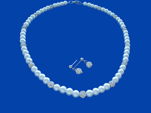 A handmade pearl and crystal necklace accompanied by a pair of crystal stud earrings.