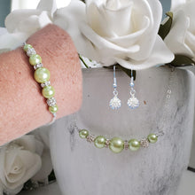 Load image into Gallery viewer, handmade pearl and crystal dainty bar necklace accompanied by a matching bracelet and a pair of dangle crystal earrings, light green or custom color
