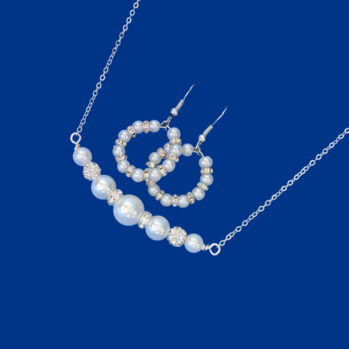 handmade pearl and crystal bar necklace accompanied by a pair of hoop earrings