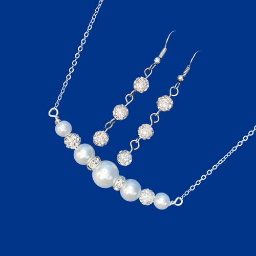 handmade pearl and crystal bar necklace accompanied by a pair of crystal drop earrings