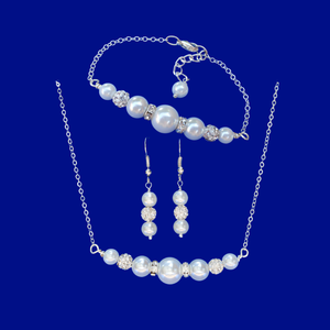 handmade pearl and crystal bar necklace accompanied by a matching bracelet and a pair of drop earrings