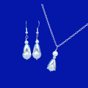 A handmade tulip and pearl drop necklace accompanied by a matching pair of earrings.