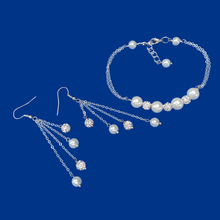 Load image into Gallery viewer, handmade pearl and crystal bar bracelet accompanied by a pair of multi-strand drop earrings