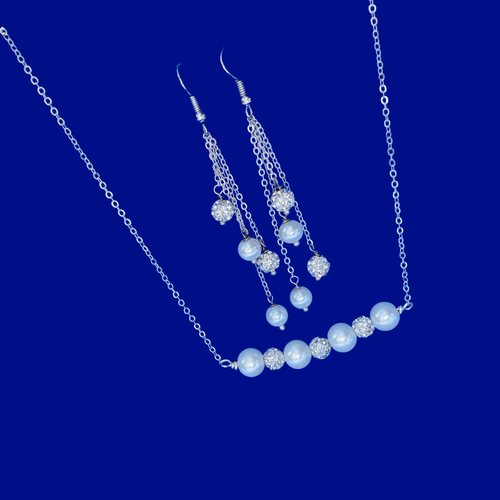handmade pearl and crystal bar necklace accompanied by a pair of multi-strand drop earrings