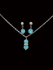 handmade crystal drop necklace accompanied by a pair of stud earrings