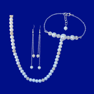 handmade pearl and crystal necklace accompanied by a bar bracelet and multi-strand drop earrings