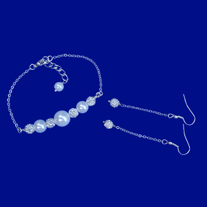 handmade pearl and crystal bar bracelet accompanied by a pair of crystal drop earrings