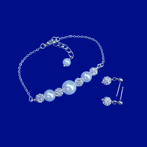 handmade pearl and crystal bar bracelet accompanied by a pair of crystal stud earrings