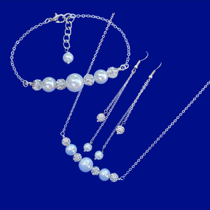 pearl and crystal bar necklace accompanied by a matching bar bracelet and a pair of multi-strand drop earrings