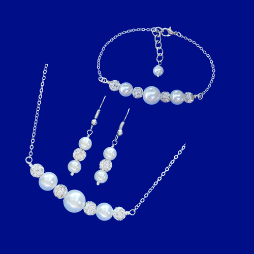 handmade pearl and crystal bar necklace accompanied by a bar bracelet and a matching pair of drop earrings