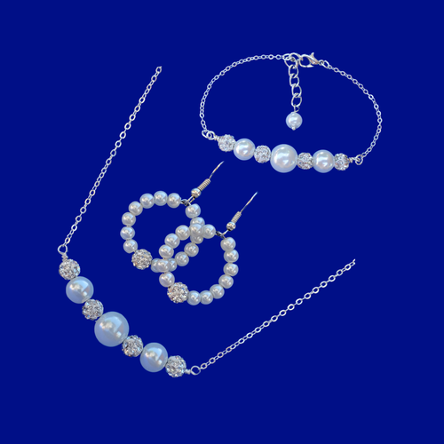 handmade pearl and crystal bar necklace accompanied by a bar bracelet and a pair of hoop earrings