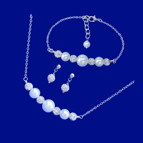 handmade pearl and crystal bar necklace accompanied by a matching bar bracelet and a pair of crystal stud earrings