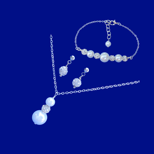 handmade pearl and crystal drop necklace accompanied by a bar bracelet and a pair of crystal stud earrings