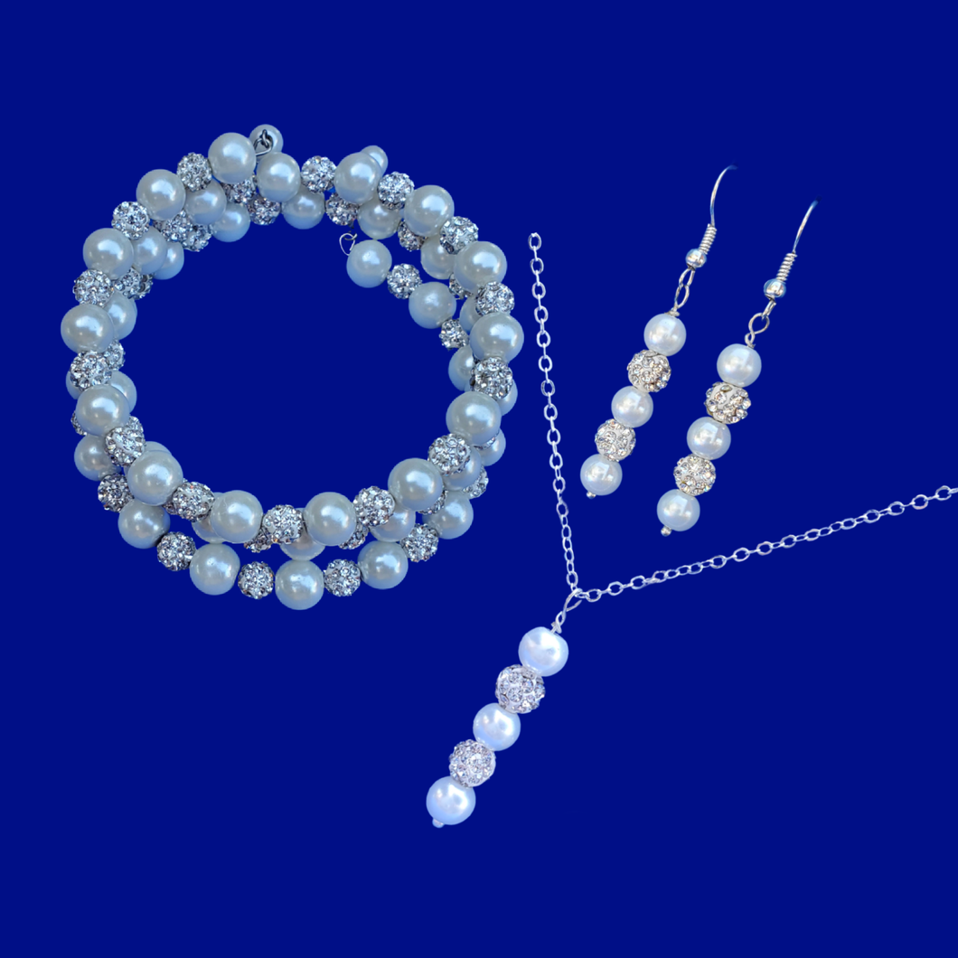 pearl and crystal drop necklace accompanied by a multi-layer, expandable, wrap bracelet and a pair of drop earrings