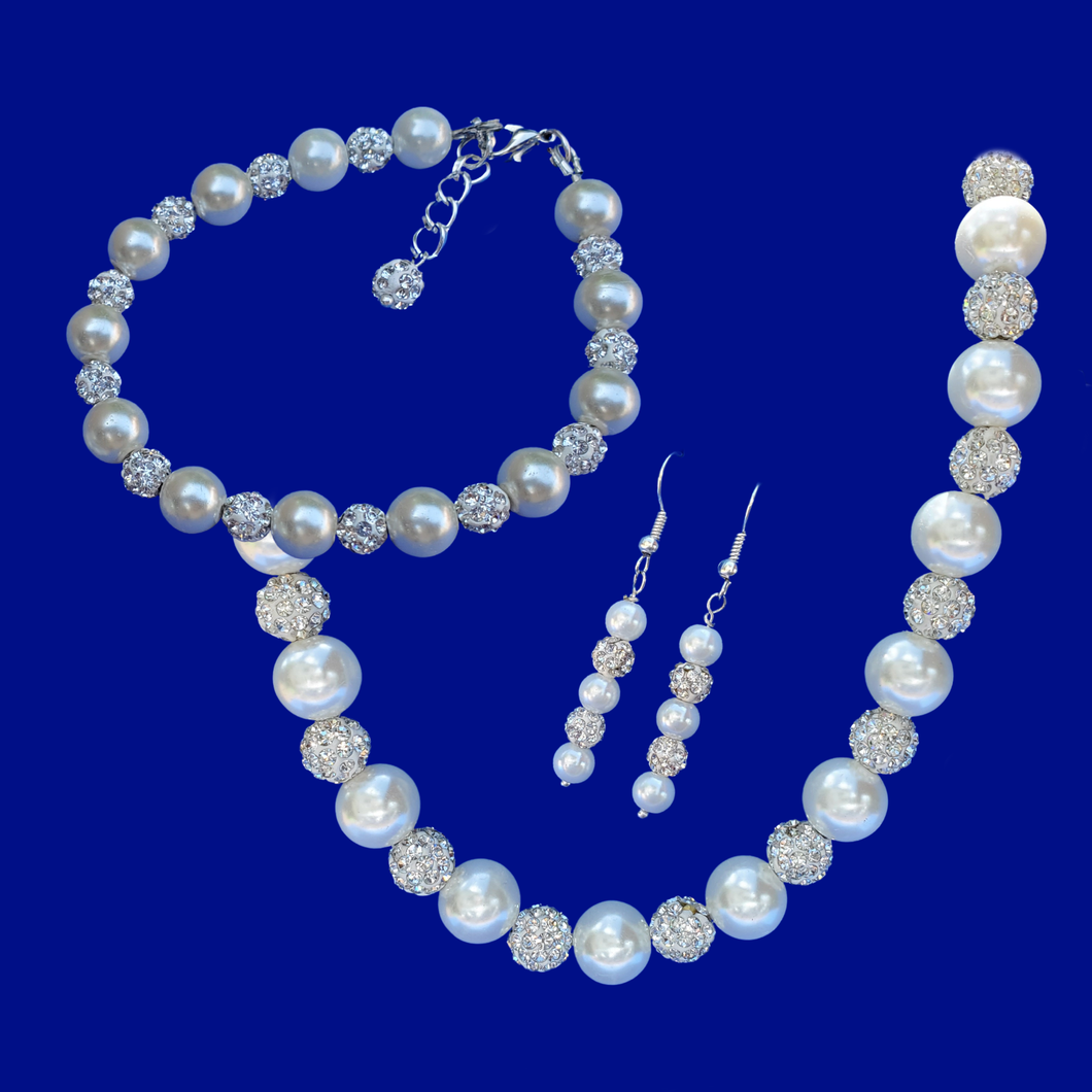 handmade crystal and pearl necklace accompanied by a matching bracelet and a pair of drop earrings
