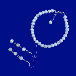 A handmade pearl and crystal bracelet accompanied by a pair of drop earrings. -Bracelet Sets - Bridal Sets - Pearl Set 