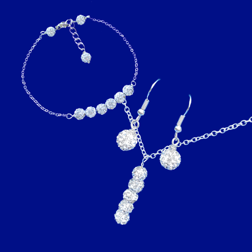 handmade drop necklace accompanied by a bar bracelet and drop earrings