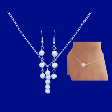Load image into Gallery viewer, ﻿A crystal bar necklace accompanied by a floating bracelet and drop earrings. 